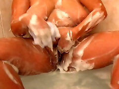 BBW curly haired blondie in the bathtub filmed naked