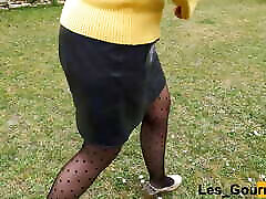 MILF in stockings and heels with a leather skirt pee squatting outside close up on her pierced cunt