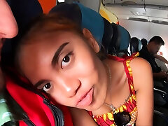 Thai teen on an airplane and on a cock
